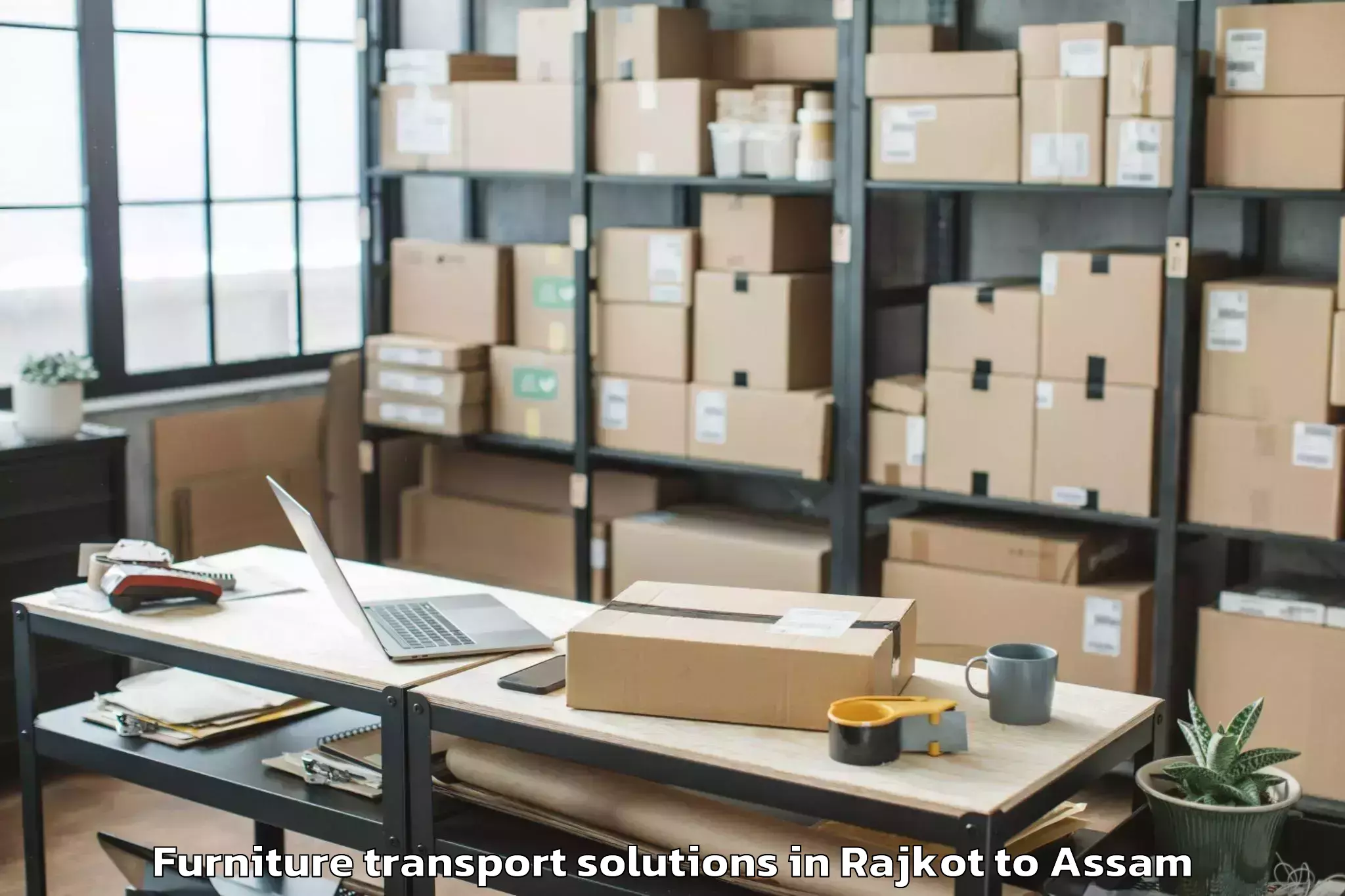 Book Rajkot to Barpeta Furniture Transport Solutions